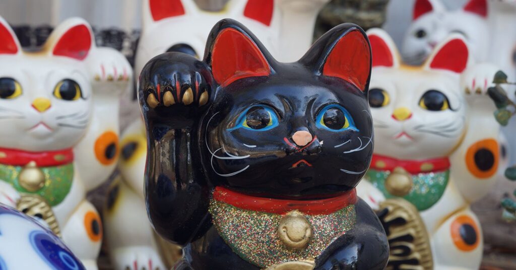 waving Black cat statue in an asian market